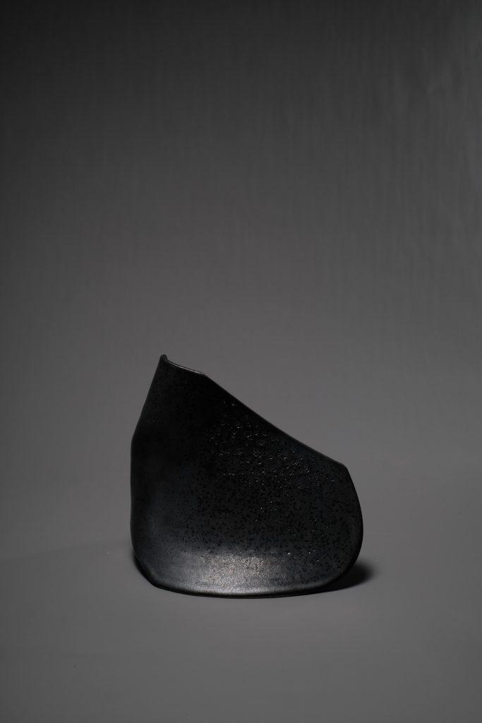 Black glazed ceramic sculpture thrown on the potter’s wheel. Ceramics, craft, contemporary art, hand made, collectable art, fine art.